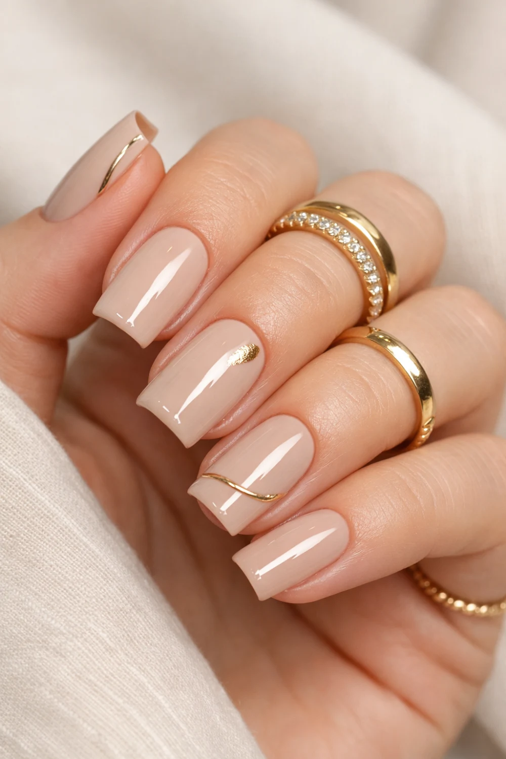 Soft Beige Accent Nails With Minimal Gold Details